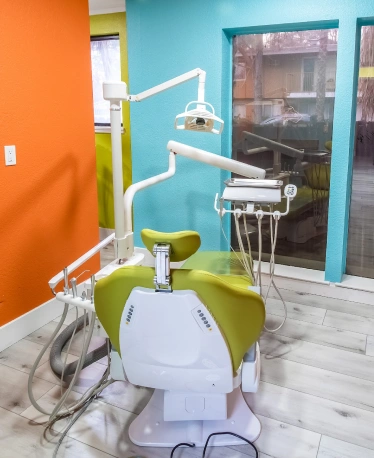 Bright pediatric dental treatment room